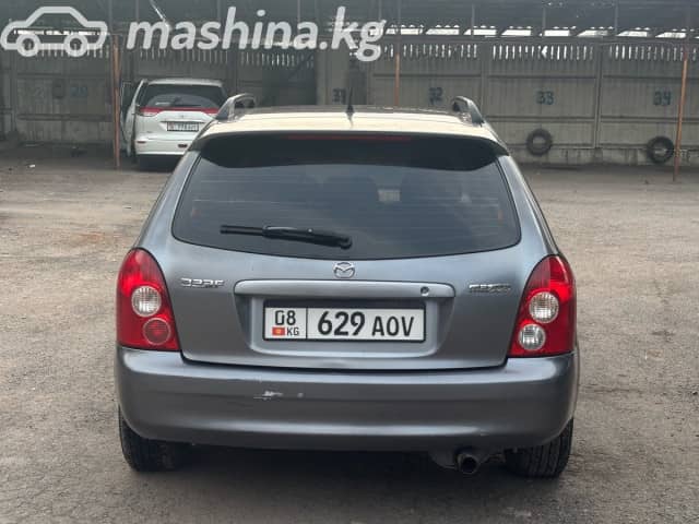 Mazda 323 VI (BJ) Рестайлинг 1.6 MT