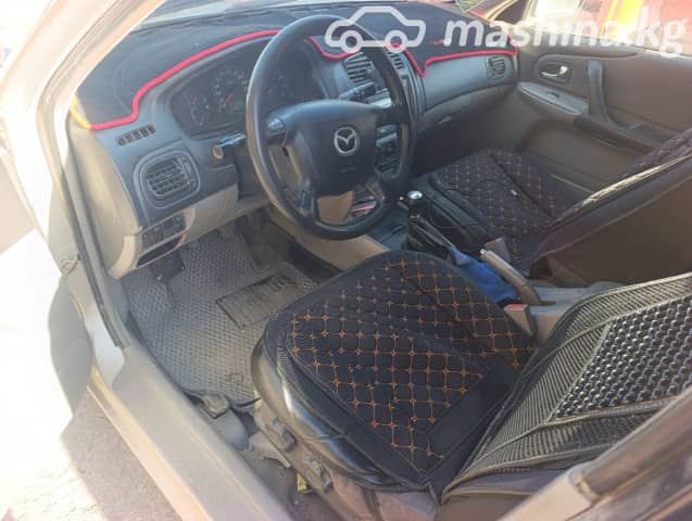 Mazda 323 VI (BJ) Рестайлинг 1.5 MT