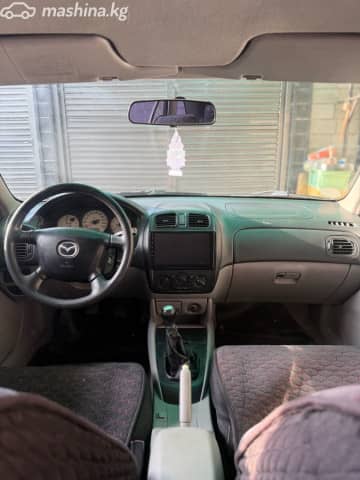 Mazda 323 VI (BJ) Рестайлинг 1.6 MT
