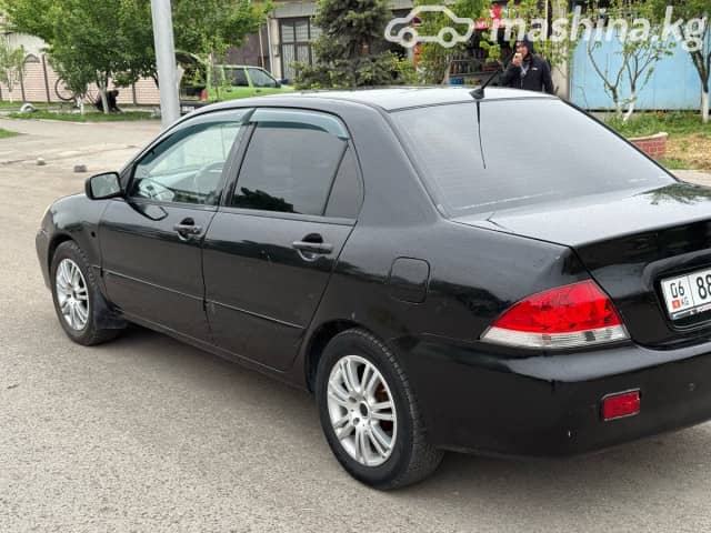 Mitsubishi Lancer IX Рестайлинг 1.6 AT
